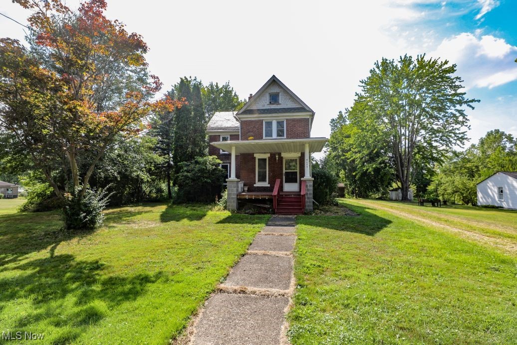 Welcome to 5677 S. Prospect Street in Ravenna Twp! If you're looking for a diamond in the rough or fixer-upper then this one is for you! This solid brick two-story home was built in 1905 by C.C. Byers and features 1,728 sq. ft. of living space with 4 bedrooms, 2 bathrooms, a charming kitchen, dining room, and spacious living room with beautiful hardwood floors, woodwork, and fireplace. There is a bedroom and full bathroom on the 1st floor, a kitchenette on the 2 floor, original hardwood floors throughout much of the home, covered front and side porches, a storage shed, public utilities and 1.14 acres of land. Don't miss your chance to restore this great old home!