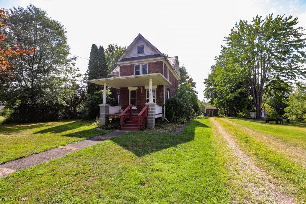 Welcome to 5677 S. Prospect Street in Ravenna Twp! If you're looking for a diamond in the rough or fixer-upper then this one is for you! This solid brick two-story home was built in 1905 by C.C. Byers and features 1,728 sq. ft. of living space with 4 bedrooms, 2 bathrooms, a charming kitchen, dining room, and spacious living room with beautiful hardwood floors, woodwork, and fireplace. There is a bedroom and full bathroom on the 1st floor, a kitchenette on the 2 floor, original hardwood floors throughout much of the home, covered front and side porches, a storage shed, public utilities and 1.14 acres of land. Don't miss your chance to restore this great old home!