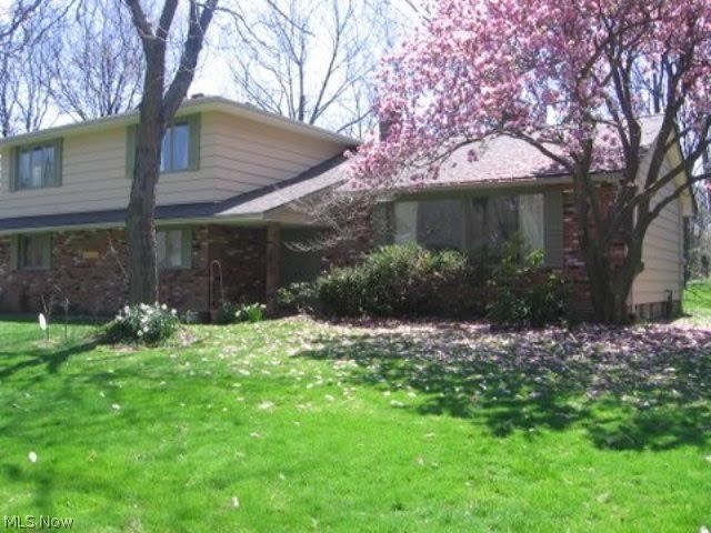Beautifully updated Beachwood home is ready for it's new owners. Professionally redesigned kitchen with Kraft Maid maple cabinetry, custom hardware, tile countertops and glass-tile backsplash. Newer appliances, including high efficiency dishwasher and large fridge with bottom freezer, newer plumbing to sink and dishwasher. Also gorgeous hardwood floors in the spacious living and dining rooms as well as newer carpet. Open family room with fireplace and a newly redesigned wet bar cabinet, with glass shelving. Neutrally designed marble and tile master bath, and new plumbing. Professionally designed tile and ceramic hall full bath. Redesigned master bedroom with a width of the room walk in closet, and built in floor to ceiling and above the hanging rod shelves and drawer. Redesigned, extra large deep linen closet in second floor hall, newer large windows in bedroom eastern and southern walls offering great natural light and ventilation. New double-pane glass in den double door opening to t