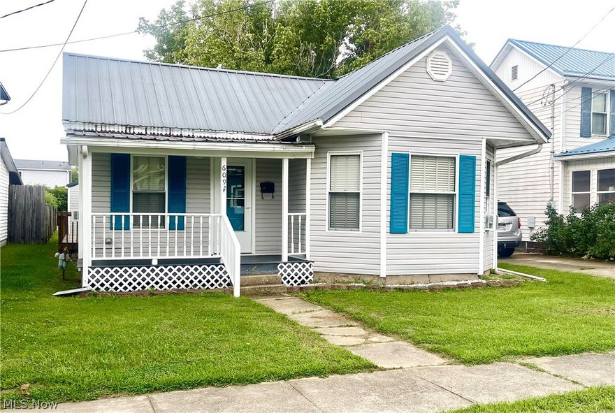 Cottage style 2 bed one floor living home in Williamstown is ready for a new owner! This cute little bungalow offers open site lines from laminate floored living area into a nicely updated eat-in kitchen.  Stainless steel appliances and modern cabinetry make this move in ready! Laundry room, updated bath and neutral carpet complete the move in ready appeal. The mud room offers pantry space, and access to wooden deck, fenced yard, single garage and extra parking off the alley. Call to schedule your tour today!