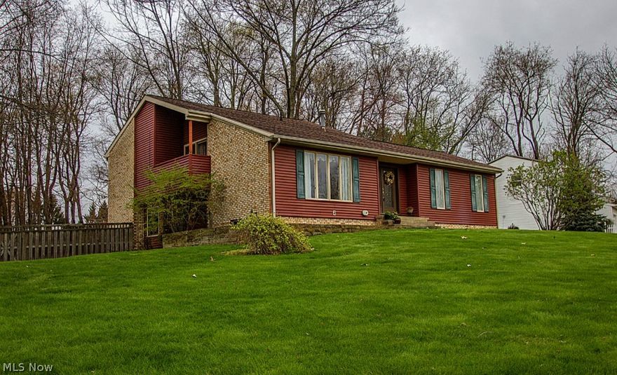 WOW! Great split level home, much larger than it looks! This is a very unique layout, very comfortable & functional. Because of lot/land, all 3 main levels are completely above ground they have plenty of light. Upper level has 3 bedrooms, 2 full baths including hardwood floors & a master bedroom with 2 walk in closets, slider glass door & deck! Main floor- toward the front of home, has large bay window in the Livingroom with hardwood floors, and wonderful foyer. The main level- towards the back of the home boasts a wonderful updated kitchen, dining room, family room walks out to back patio, half bath & main floor laundry off the kitchen.  Then there is also a lower level (4) below grade that is clean, and spacious storage in the basement. Many other updates: Furnace and Air Condition in 2009, Main bathroom redone in 2011, New Carpet in November 2013,  Kitchen appliances 2012, kitchen counters, sink and faucet in 2014! Call today for a showing.