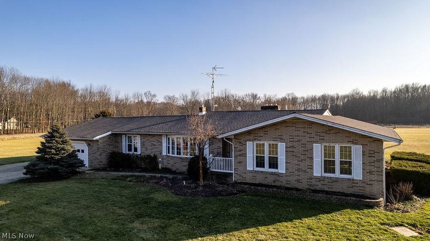 Sprawling 2680 sq ft. brick ranch in a beautiful country setting on a corner lot!  This home has frontage on 2 roads and has 3 parcels totaling 11.4 acres!  Upon entering the home through the front door, you will be impressed with the large foyer. Moving through the home to your left, you will enter a beautiful formal living room and dining room. This area needs to be seen to be appreciated. (It is huge) As you transition to the back of the home, you will find a large eat-in kitchen, newly remodeled half bath, large laundry room plenty of closet space, an exit to the back yard and direct access from the 2 car attached garage. Moving through the kitchen, you will find the warm and inviting family room equipped with a fireplace. Behind the family room is a 4-season room with a hot tub (that stays!) tons of windows and natural light and a new wall heater! (Just installed a few weeks ago) The west half of the home has more hallway closets for storage, a full bathroom and 3 generous bedroom