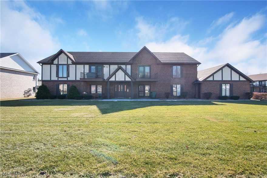 Ranch style condo unit on the 2nd floor of an all brick 4 flex. The unit has been updated throughout. Large open concept livingroom with sliding glass doors to the balcony patio. Formal dining room with swinging doors to the kitchen. Updated kitchen with wood floors, new sinks, and counters. Fresh paint and newer flooring throughout. 2 large bedrooms and 2 full updated baths (including a master bedroom suite with full bathroom). Lots of closets and storage spaces. In unit laundry room. New furnace and hot water tank. Central air! All appliances stay. The building has a new roof, and theres an attached garage with additional storage closet. Plenty of parking. Quiet street with easy access to everything. Home warranty is provided for worry free purchase.