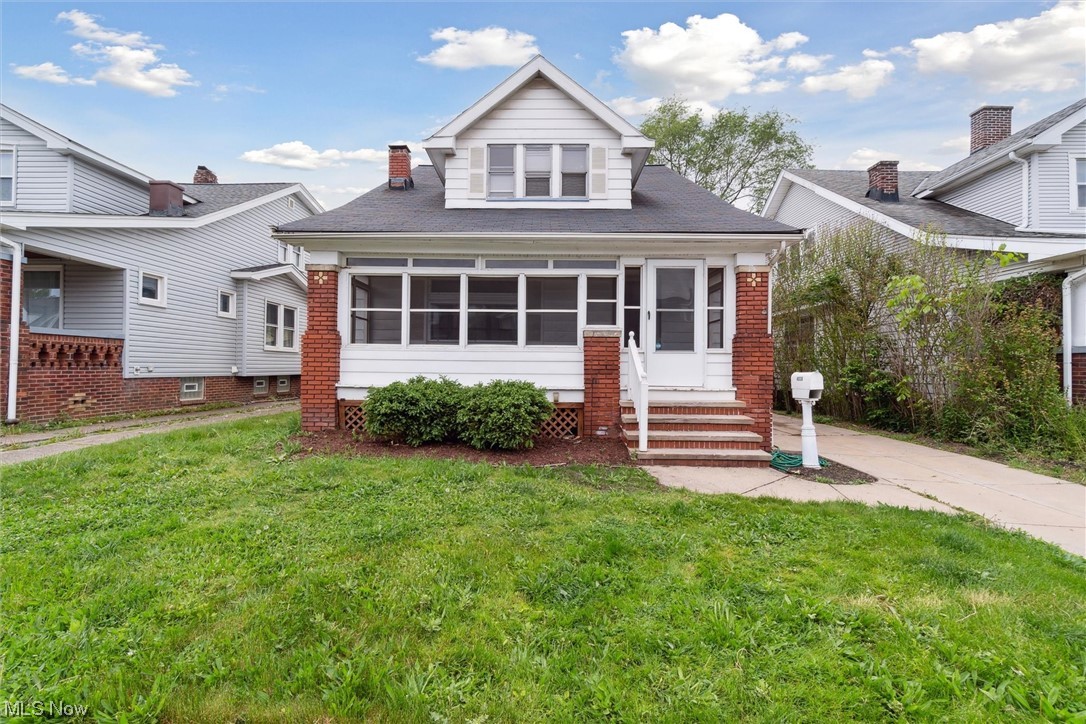 This Craftsman-style home is full of charm and character! From the unique archways, to the beautiful fireplace with surrounding built-ins, and original woodwork, this house is perfect for anyone who appreciates the craftsmanship of older homes. Enter through the comfortable enclosed front, great for relaxing on a warm day. Inside you'll find a generously sized living room with original hardwood floors, lots of natural light, working fireplace and built-ins. Continue into the spacious dining room, which features another set of unique built-ins. In the neighboring room you'll find the large kitchen with granite countertops and stainless steel appliances. Rounding out the first floor are a large rear-hallway, 2 nice-sized bedrooms, and a full bathroom. Upstairs you'll find another bedroom and a huge attic storage area. The basement features a rec room area and additional full bath. The fully fenced back yard features a nice deck and fire-pit area. The home is located just a block