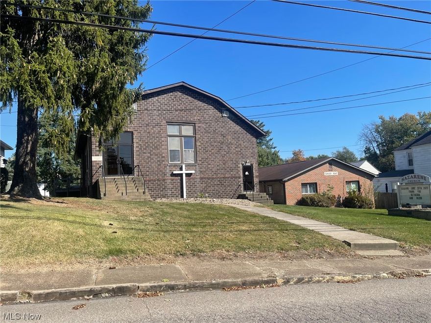 Former church in downtown Bethesda. This 2-story Nazarene Church building is all brick and has 4,320 sf and a wheel chair ramp. There is a covered walkway to Smith Hall that is the church's recreation center. It is approximately 1,500 sf with a spacious, open area; a full kitchen; full bathroom and an office. Plenty of parking.