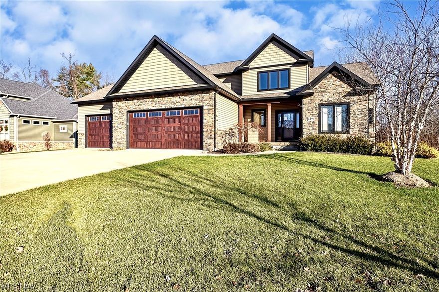 4479 Broadley Circle, phase four in the Kings Ridge development, Green Local Schools. A 2014 Parade of Homes offers many upgrades and amenities in a well known Helen Scott Custom Build Home.. Open floor plan, Four bedroom, three and a half bathroom, main floor owner's suite, first floor laundry, a three car oversized garage, finished basement with a full bathroom. Stamped cement patio off the backside of the home. A gourmet kitchen (new faucet, garbage disposal) boasts with custom cabinets, beautiful granite counters, some updated appliances, walk-in pantry, a center island with banquet seating, natural hickory flooring and dinette area all open to the spacious great room, twelve foot ceilings, wood beams, a stone face gas fireplace (recently serviced, new blower) and built-in entertainment. Tray ceiling in the owner's master suite located on the main floor is private and spacious. You will appreciate the dual granite counter/ sinks, custom tile walk-in shower, private commode, adjacent walk-in closet with lots of light and bench/storage seating. Smaller closet in bedroom offers a Murphey Door. Main front door opens to the two story foyer with built-in bench and open stair case, a cat walk between the three bedrooms, an on suite full bathroom with dual counter/ sinks and private commode/ shower room. A finished family room, media/ movie room, full bathroom and plenty of storage in the lower level basement. The outdoor patio/ entertainment area featuring stamped concrete, a pergola, stone pillars and built in grill with granite countertop.