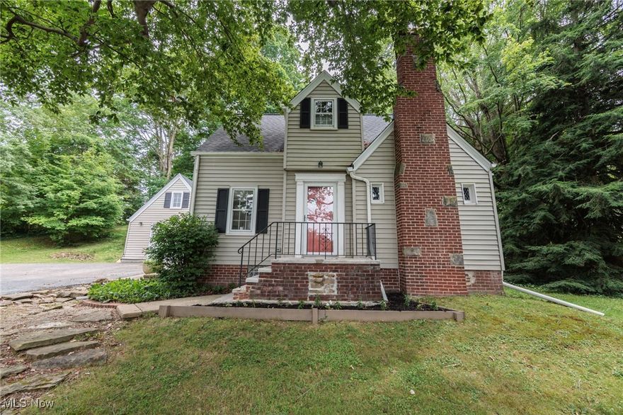 Charming, Updated Home with Land & Outdoor Living! This beautifully updated home offers the perfect blend of charm and functionality. Sitting on a spacious lot, it features a large, private outdoor area ideal for relaxing, entertaining, or gardening. Inside, you'll find modern kitchen with white shaker cabinets, subway tile back splash, and stainless steel appliances. The kitchen opens to a nicely sized dining area that flows into the cozy family room with a wood burning fireplace. The main level is complete with a convenient half bath and mud room. Upstairs you will find two nicely sized bedrooms and an updated full bath! On the lower level, there are two nicely finished areas that could be used as a rec room, home office, or play area! finishes. Updates include: new roof in 2023 and newer furnace and central AC. Enjoy the best of both worlds—peaceful surroundings with easy access to shopping, dining, parks, and more. A rare find with space, style, and location!