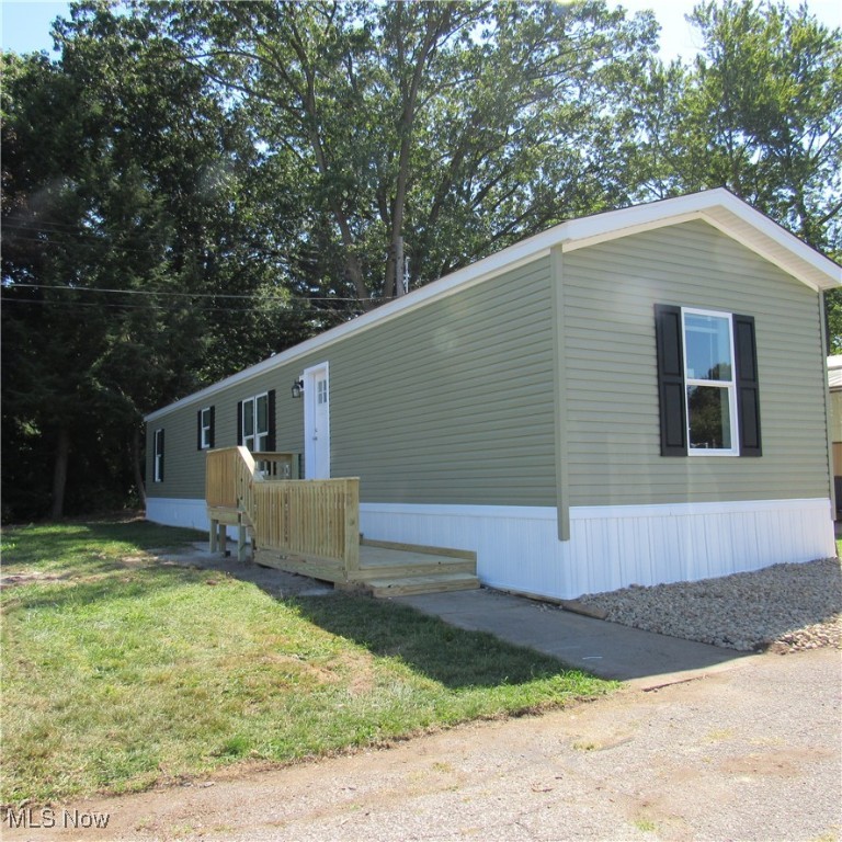 Brand New never lived in quality-built ranch home, crafted in Sugarcreek Ohio including a seven-year warranty. Live in your NEW Home with a peace of mind Knowing you're the First owner. Spacious open concept living area, ideal for relaxing or entertaining. Kitchen features 8 Inch stainless steel double bowl sink with chrome pull down faucet ,30Inch stainless-steel gas stove /oven with power range hood, microwave, stainless-steel dishwasher and refrigerator. ALL new Whirlpool appliances W/ warranties.
Flat Panel hardwood Shaker cabinet doors /chrome pendulum lighting over large island with 20-amp USB port in island.
Crown Moulding, vinyl flooring, double hung window W/blinds, not to forget 4-inch recessed Lighting throughout home. Digital thermostat, living room ceiling fan are a few of the amenity's w/this two-bedroom, two full bath home. Primary bedroom has en-suite full bath with shower. Located in the Center of Portage Lakes (City of Green). Enjoy the near-by, Golfing, Boating, Restaurants, Fishing, plus Numerous State Parks to visit. Be Adventurous: Join the Dragon Boat Rowing Team at Craftsman's Park or Within a short distance, rent a dock and enjoy your boat. Community is currently being revitalized with new homes. Be sure to call your Favorite Agent and View this new home. Current lot rent includes city water/ sewer/ trash and snow removal.
