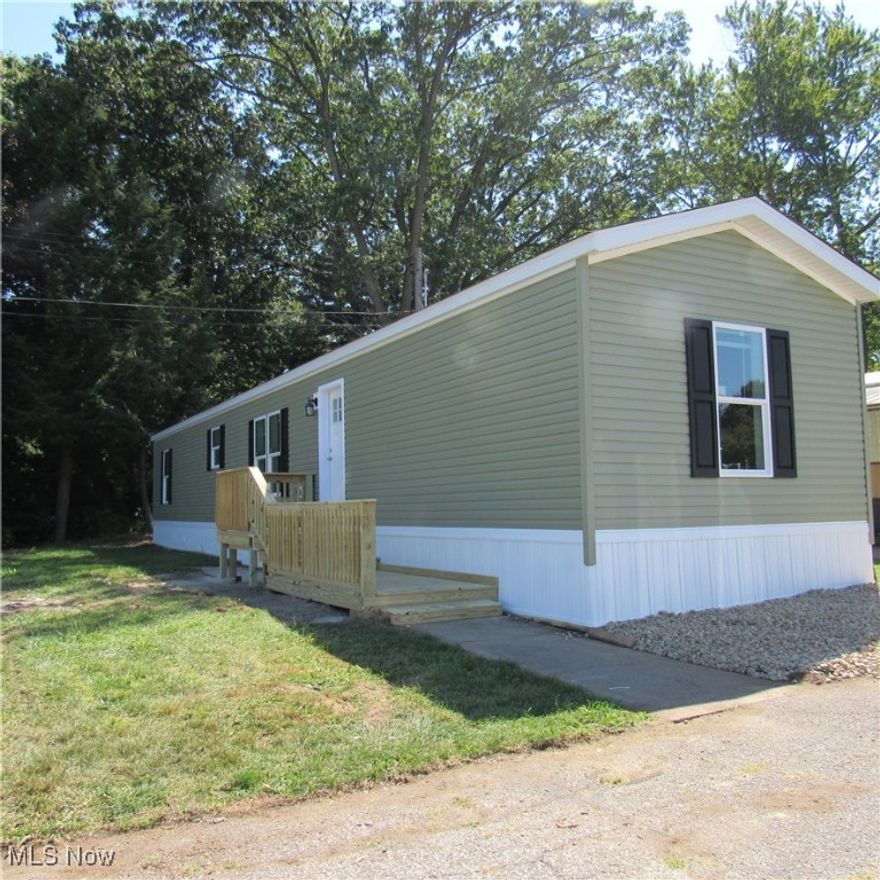 Brand New never lived in quality-built ranch home, crafted in Sugarcreek Ohio including a seven-year warranty. Live in your NEW Home with a peace of mind Knowing you're the First owner. Spacious open concept living area, ideal for relaxing or entertaining. Kitchen features 8 Inch stainless steel double bowl sink with chrome pull down faucet ,30Inch stainless-steel gas stove /oven with power range hood, microwave, stainless-steel dishwasher and refrigerator. ALL new Whirlpool appliances W/ warranties.
  Flat Panel hardwood Shaker cabinet doors /chrome pendulum lighting over large island with 20-amp USB port in island.               
Crown Moulding, vinyl flooring, double hung window W/blinds, not to forget 4-inch recessed Lighting throughout home. Digital thermostat, living room ceiling fan are a few of the amenity's w/this two-bedroom, two full bath home. Primary bedroom has en-suite full bath with shower. Located in the Center of Portage Lakes (City of Green). Enjoy the near-by, Golfing, Boating, Restaurants, Fishing, plus Numerous State Parks to visit. Be Adventurous: Join the Dragon Boat Rowing Team at Craftsman's Park or Within a short distance, rent a dock and enjoy your boat. Community is currently being revitalized with new homes. Be sure to call your Favorite Agent and View this new home. Current lot rent includes city water/ sewer/ trash and snow removal.