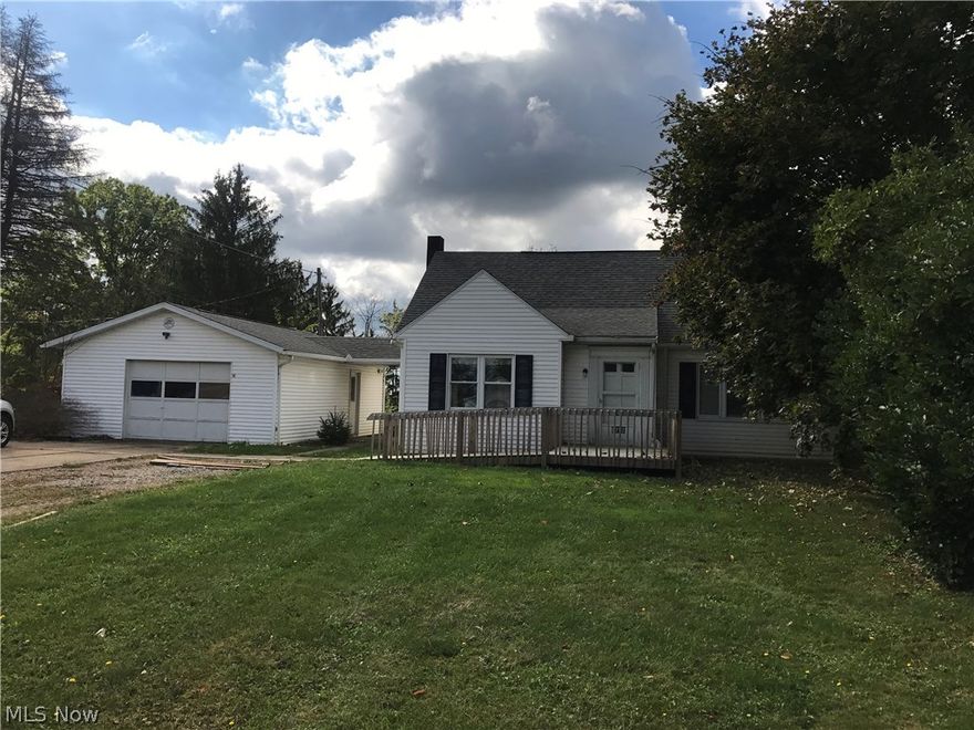 Nice 3 bedroom 2 bath home with beautiful hardwood floors. Detached 1 car garage with covered walk way to house. Wood shed and storage shed in back. Electric heat but has an outside woodturner that can be used to heat the home as well. Kitchen and fireplace in the downstairs family room. Lots of storage in this home. Upstairs bedroom has built in dresser drawers and gun cabinet. Beautiful view from the enclosed back deck. Newer septic system.