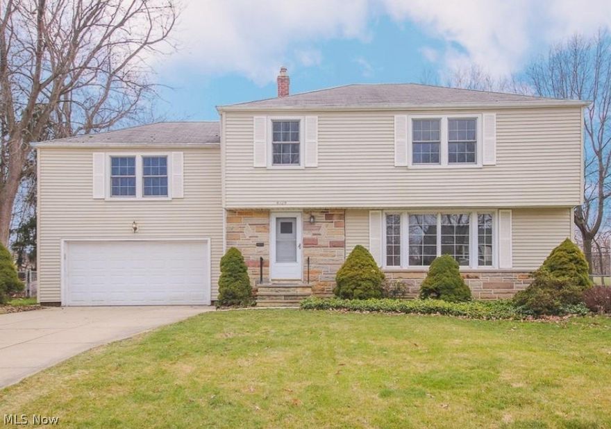 Welcome Home to a spacious 5 bedroom 3 bathroom Richmond Heights Colonial that has been beautifully transformed and updated with smart technology. Enjoy cooking and entertaining in your gorgeous chef's kitchen featuring a massive waterfall island, large ceramic floor tiles and contemporary fixtures and finishes. Have your favorite cooking tutorials displayed directly on your smart refrigerator and preheat your oven from your phone. All bar and island seating included! Large family room is located off the kitchen along with a full bathroom, first floor laundry room and a first floor bedroom. Upstairs are 4 bedrooms with amble closet space. Owner's suite has a built in shelving with mini fridge. The full bathroom has been beautifully renovated with a walk in tiled glass shower, double vanity, and brass fixtures and finishes. The lower level is finished for additional living space and entertaining. Enjoy new tiled flooring, large wet bar with granite countertops, a beer tap and beverage r