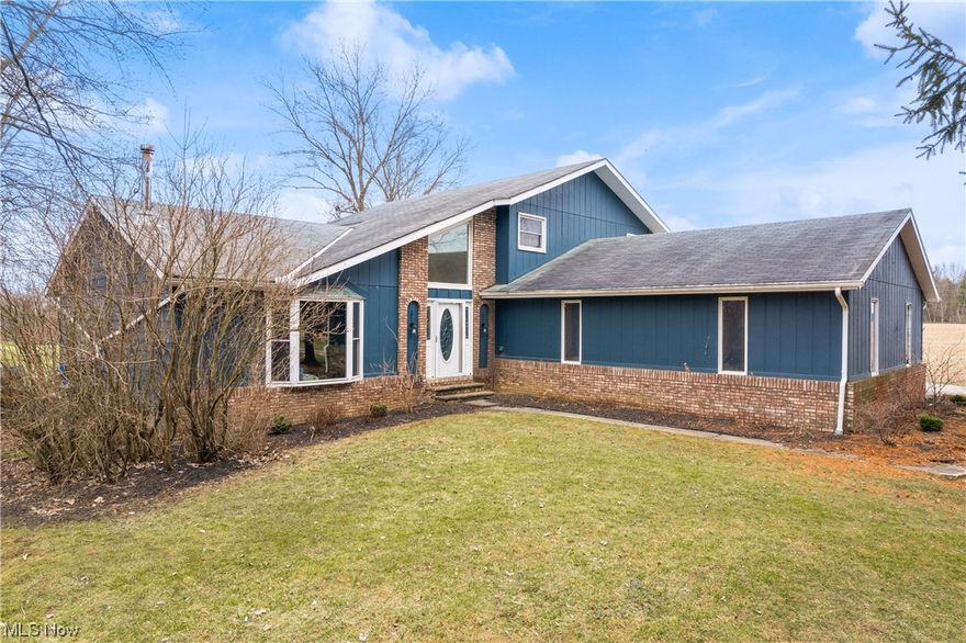 Step into a world of sophistication with completely custom woodwork, cabinets, countertops, and accent walls. The seamless fusion of design elements creates a unique ambiance throughout the home, setting it apart from the ordinary. The spacious layout encompasses 4 bedrooms, offering ample space for relaxation and rejuvenation. With 2 full bathrooms and 2 half bathrooms, convenience is at the forefront. Beyond the main living areas, enjoy additional entertainment space in the finished rec room, complete with bar. Whether it's a movie night or a game day, this versatile area caters to various leisure activities. Outside, escape to your private retreat on 5.76 acres, featuring a stocked pond for serene fishing days, over 1,000 planted trees enhancing the landscape, a sand volleyball court for recreation, a playground for family fun, and a dirt race track for the adventurous. Embrace the tranquility of country living while being conveniently close to local amenities and major commuting routes. Whether it's the custom interior, the recreational paradise, or the expansive acreage, this property is an absolute gem. Schedule a showing today and experience the perfect blend of modern living and outdoor recreation!