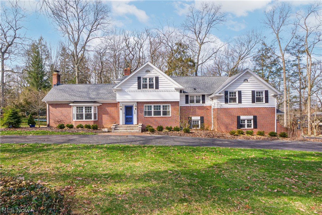 Welcome home to this beautiful home, nestled on a picturesque setting in the desirable Fairlawn Heights neighborhood. Walking in you will find the great room featuring the fireplace, sweeping ceiling, bay window, and access to side patio. Elegant, formal dining room boasts crown molding, wainscoting, and hardwood flooring. Impressive, gourmet kitchen offers granite counters, new stainless steel appliances, extensive cabinetry, heated tile flooring, and glassed breakfast nook with 11 ft. ceiling and outdoor access. The natural light in this home is absolutely stunning! Updated half bath conveniently located for guests plus 1st floor laundry room. The spacious owner suite with a newer bath and additional bedroom complete the 2nd level. 3rd level offers two additional, large bedrooms and main hall bath. There is also a lower level family room which is connected to the garage with a fireplace for even more living space. The heated, two car garage with glazed tile walls also has a "mud bath