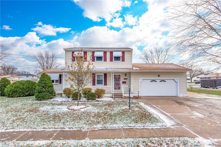 This delightful 3-bedroom Colonial on Lorain's west side combines classic charm with modern updates. The spacious first floor features a cozy family room with a wood burner, a bright living room, and a convenient half bath. The kitchen is a chef's dream, offering bar seating, ample cabinetry, a pantry area, and an abundance of natural light streaming through a plant window. The family room's bay window adds to the home's inviting atmosphere. Outside, the attached two-car garage is complemented by an additional concrete parking pad, perfect for a boat or camper. Enjoy outdoor living on the screened-in porch and the spacious deck overlooking a large lot. Upstairs, three generously sized bedrooms with ample closets and a full bath provide comfortable accommodations. The basement, waterproofed in 2015 and partially finished with Owens Corning walls, ensures durability and functionality. A welcoming front covered porch, a new roof installed in 2022, and most windows updated to complete this home. It is ready for its next owners to enjoy.