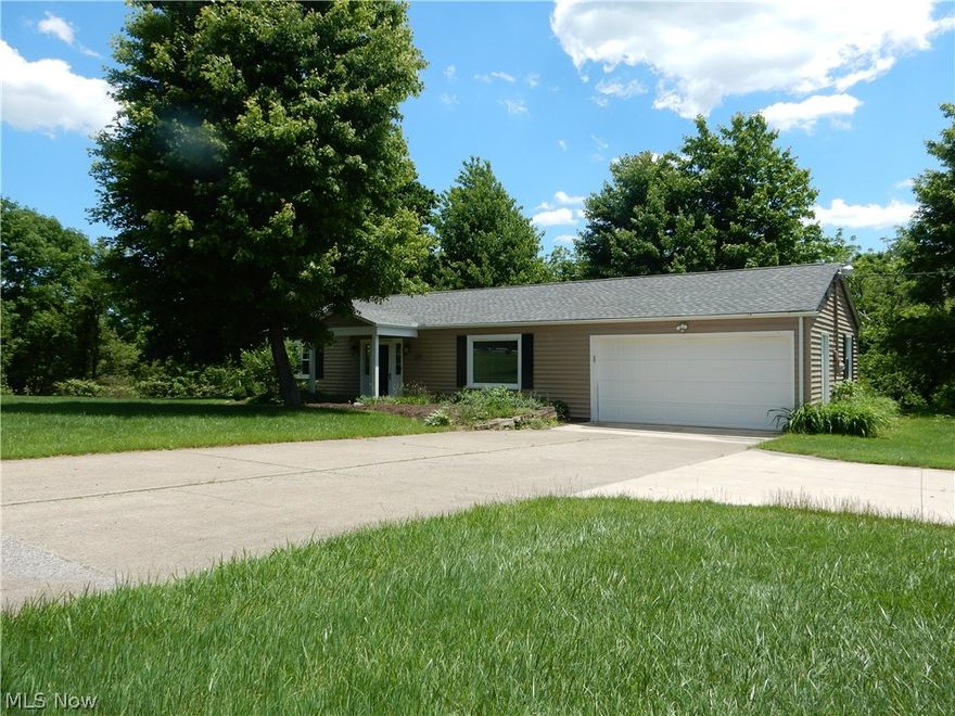 Over one acre of privacy, and well maintained grounds, 20 X 21 Garage, 20 X 20 out building.  Remodeled...Roof 5 yrs, water softening equipment, pumps, and pressure tanks 5 yrs., Kitchen has granite counters, ceramic floors, stainless appliances (Maytag) updated cabinets 5 yrs.,  Remodled Bath features a walk in ceramic shower, and vanity 5 yrs, Family room has a raised hearth fireplace.