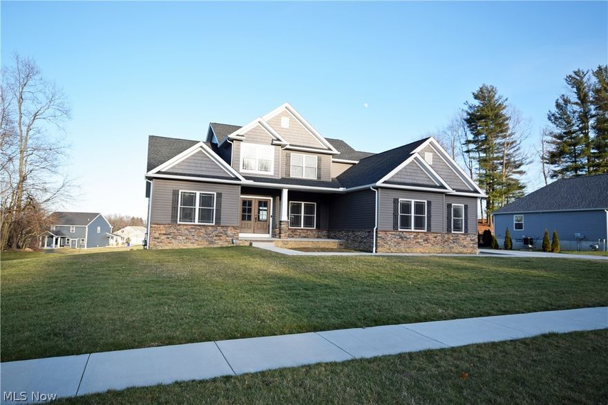 Welcome to 1582 Country View Rd. in Brimfield!  If you're looking for new construction without waiting or investing hours into picking everything check out this house! The home was custom built by Touchstone Builders in 2018 and is better than new! This one has everything you're looking for 1st floor master suite, 2 story entry with wrought iron staircase, 2 story great room, 1st floor laundry, 1st floor office, oversize garage, walkout basement, lot and half, great neighborhood and the list goes on and on! This home has been equipped with many smart home features including thermostat, audio, video and security system. The master suite is stunning with spacious master bathroom featuring a gorgeous oversized tiled shower with glass, dual vanities, separate toilet room and dual walk-in closets. The great room features a fireplace and opens to the kitchen and dining area. The kitchen includes stainless steel appliances, under counter mini fridge and wine cooler, breakfast bar, walk in pantry, eating area which leads to patio door ready to be built out to the deck of your dreams! Basement includes full height windows on the both sides of the basement and patio door to grade which lends perfectly for additional finished space in the future! The property is priced to sell fast and is at or below new build prices. It won't last on the market long so call today to schedule your personal tour!
