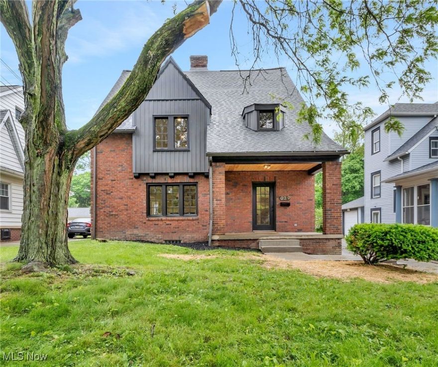 This gorgeous and fully renovated 5 bedroom 3 bathroom brick Colonial. High style design and high quality craftsmanship describe this stunning home. It is nestled in one of Akron's historic and highly sought-after neighborhoods. With its spacious floor plan, modern finishes, it is perfect for both entertaining and family living. Welcome your guests into the home on the spacious front porch with custom wood ceiling. Feel the pride of this home immediately as you enter. You are greeted with the grand staircase on your right and the timeless and classic living room on your left. Anchored by a gas fired /wood burning fireplace the living room is a beautiful and bright place to entertain. Seamlessly connected to either the completely updated kitchen or a formal and airy dining room. The kitchen is completely new boasting all new custom cupboards, granite counters and stainless steel appliances. A dedicated office sits strategically in the back of the home, giving privacy and function. An updated half bathroom and mudroom finish off the main floor. Up the staircase to the next level you will find 3 bedrooms and a completely updated main bathroom. The primary bedroom is straight out of a magazine. It is very spacious and expansive including 2 closets with built in. 1 closet is a walk in closet. A separate quintessential sitting area is a great space to unwind. Up 1 more level to 2 more bedrooms and another fully updated and renovated full bathroom. So much living space to spread out and enjoy. The clean and dry basement offers options for storage or creating your own family room/kid space. Even the garage has been refreshed. Nothing to do but move in.Don't miss your opportunity to live in this classic Home.
