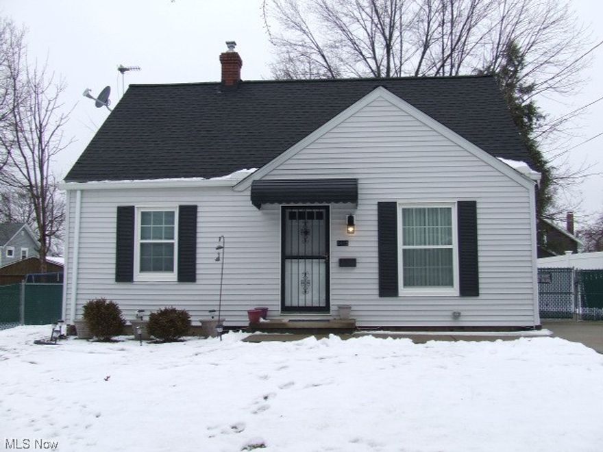 Wonderfully updated 3-bedroom Cape Cod with 2 bedrooms and full bathroom on 1st floor.  Living room and all 3 bedrooms have new carpet, new paint and ceiling fans.  Eat-in kitchen has farm sink, new cupboards and countertops, ceramic tile floor, and stainless steel dishwasher and gas stove.  Updated bathroom with deep tub, newer surround, new medicine cabinet, built-in towel cubby, and ceramic tile floor.  Top of stairs has shelf for those personal extras and bonus space that is perfect for dressing room, office, nursery or whatever you want it to be.  Third bedroom upstairs has new carpet, new paint, new lighting with it's own baseboard heating, plug for window air conditioning, and closet with built-ins.  Waterproofed Basement has area that could be used for rec room area or storage, laundry area with both electric and gas dryer hook-ups, utility sink, sump pump, glass block.  Detached garage with carport that could cover a car or be a covered patio, with hot tub plug.  Backyard is completely fenced in with privacy fence and chain link locked gate.  Gate is currently at middle of driveway so pets could be let out the side door. Seller could move gate closer to garage so car could pull in further in the driveway.   There is oak floors on first floor under the carpet in fair shape.  Lawn mower and snow blower in garage will stay.  This HOME is just waiting for you to move in!!