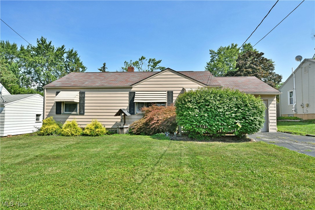 Two floors of finished living space await this endearing Girard ranch, serving up huge potential in a cute, convenient package. Take advantage of the lush landscaping and fenced-in backyard that adds to the curb appeal here. A covered rear patio area overlooks a darling storage shed as you enjoy the serenity. Inside, a welcoming living room delights with hardwood flooring and plenty of natural light as the tiled entryway continues into the nearby kitchen. Here, casual dining accompanies the warm wood cabinetry and tiled backsplash that joins the mauve colored countertops. Opposite the living room, a pair of sizeable bedrooms offset a handsome full bath with its own tiled walls and emerald-colored accents. Down below, the finished rec room sweeps around to find a bar area for entertaining. A second full lower bath is located adjacent to laundry and utility services as it completes the package. Don’t hesitate, this one won't be around for long!