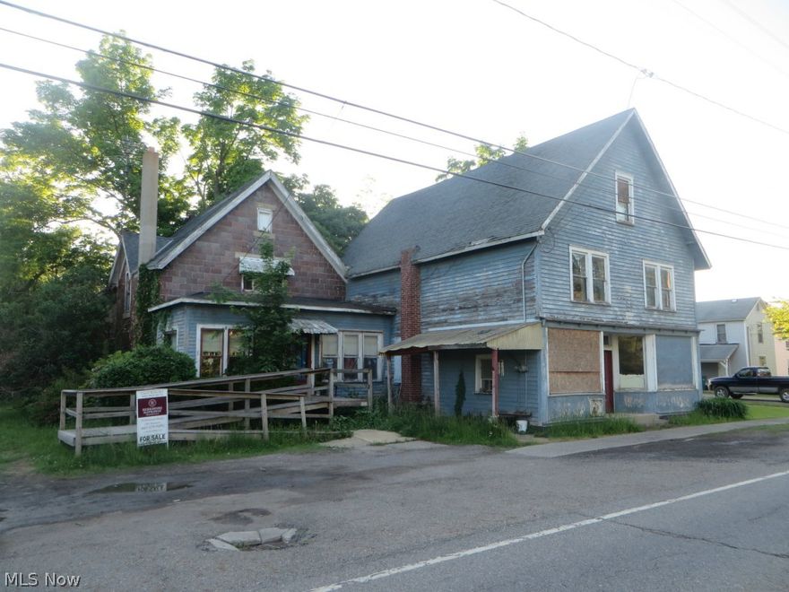 House in fair condition. There are two rooms attached to side of house, plus second story. To the front is what used to be a store. It measures approx. 26x35. Propane can be used for a stove in the kitchen. Please watch your step when going upstairs and into store area. Shared drive. Woodburner does not stay. Home is in transition; many items will be left. Roof 7-8 years old. Potential to live in house and have business attached.
