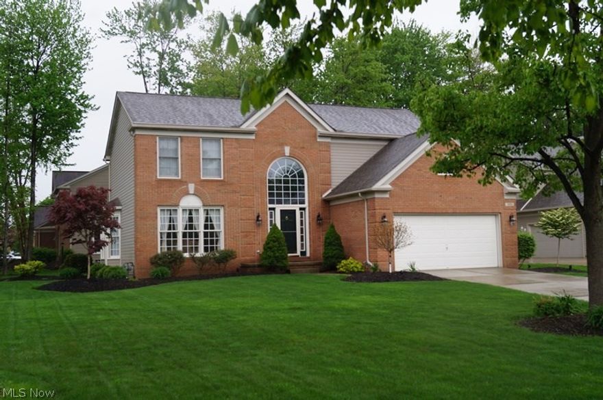 Charming Full Brick Front colonial in The Woods! Neatly landscaped and sprinklered .32 acre lot with a treed view! Bright and cheerful interior with large windows granting an abundance of natural light! 2 story foyer, enormous kitchen with spacious working island has stainless steel appliances, spacious step-down family room with wood burning fireplace, elegant dining room with bay window, vaulted Master suite has glamour bath with huge steeping tub and walk-in closet, and large nicely finished basement with glass block windows! Newer roof - sliding door - appliances - lighting fixtures - shower door - storm door - kitchen countertops - hand scraped flooring in the foyer - eat-in kitchen - living room - dining room -family room! Interior is decorated in today's popular colors and is flawless in condition, a beautiful deck overlooks private wooded rear yard, and The Woods offers access to 8 acres of green space with playground-tennis courts-soccer field and access to Kinsner Elementary!