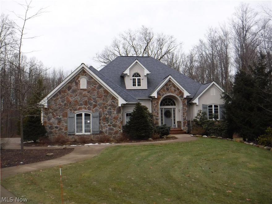 An absolutely stunning Ranch in Hinckley! Wide open floorplan with soaring ceilings. Cherry cabinets w/ white/black granite counters anchor the gourmet kitchen.Comfy great room w/tone fireplace has amazing views of the wooded backyard. Jack-n-Jill BA separates 2 large BRs. The spacious master retreat has a fireplace and new walk-in shower plus new hard surface vanities! Two ample sized walk in closets are located in the hall leading to the bathroom. A generously sized laundry room can be found steps away from the kitchen. Formal dining room with hardwood floors welcomes guests to the home. A cozy covered deck is accessed off the breakfast room( perfect for Winter grilling) The lower level is out of this world! a granite/stone bar, hearth room, enormous rec room, and the multiple windows make it hard to believe that you are on a lower level! A craft room w/ sink and a wine making room are added features. A spare BR and full bathroom are steps away from the great room. Large storage area