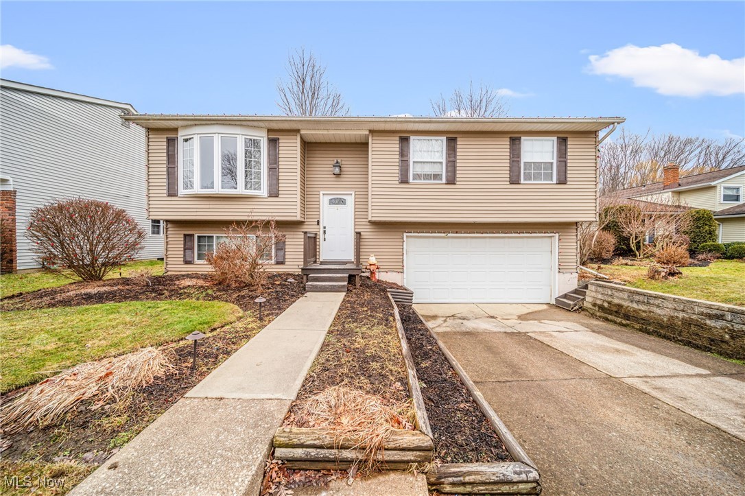 Open House Sunday, March 2nd from 12p-2p. Welcome home! Come tour this updated 3 bedroom 2 full bath home in a quiet neighborhood in Mentor-on-the-Lake. Step inside the front foyer and you'll notice this bi-level offers two distinct living areas for enjoying time with friends and family. Upstairs is an open concept eat-in kitchen and living room with gleaming hardwood floors. Down the hall you'll find an updated full bathroom and three bedrooms. Downstairs you'll find the second living area, a cozy rec or family room with plenty of space and a convenient full bathroom. The second full bathroom features a walk-in shower with a tile surround. Next you'll find the laundry/utility room and then lastly a large storage closet and the attached 2-car garage. A raised deck extends off the kitchen and overlooks the large backyard. This property sits on a 9,000 square foot lot that backs up to Veterans Memorial Park. Lake Erie, Mentor Beach Park and Mentor Lagoons Nature Preserve are just a short walk or drive away. Come experience all the area has to offer, including shopping, golfing, restaurants, and parks!