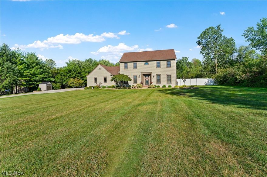 This is your opportunity to own a fully updated home on almost 3 private acres in the Canfield school district.  House has new flooring throughout.  The huge kitchen with large island was updated in 2021 with Cambria quartz countertops, induction cooktop, dishwasher and fridge.  The kitchen opens to the dining area with vaulted ceiling filled with natural light, perfect for entertaining. New sliding doors(19) open from the dining area to the back deck where you 
can spend evenings enjoying the tranquility and privacy of your wooded back yard.  Cozy up to the wood burner on chilly evenings or watch the sunrise 
from the sunroom with cathedral ceilings.  Enjoy the great room with crown molding.  Additional room on the first floor that can be used as a bedroom, office or children's play space. First floor laundry and 1/2 bath.  Upstairs you'll find the the master bedroom with large walk in closet and fully remodeled(20) master bathroom with huge double vanity with Cambria quartz countertops and luxurious 4'x5' floor to ceiling glass and tile shower.  Two additional bedrooms and hall bath on second floor.  In the basement, you'll find a large rec room with brand new flooring(22) and another bonus space that can be used as a bedroom or office.  The attached 2.5 car garage has ample space and access to basement area.  New roof in 2009. All exterior doors were replaced in 2019.  Enjoy the privacy of the country while still being close to schools, shopping and dining.