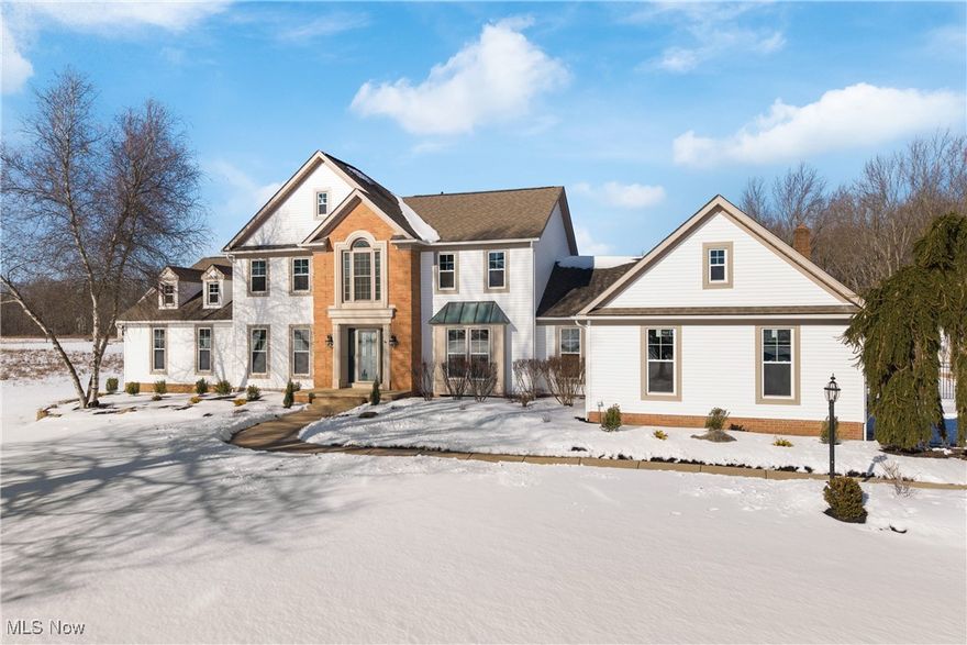 Discover this stately colonial, nestled on over four sprawling acres, in Green Schools! Enjoy the peacefulness of the land with breathtaking views of the peaceful pond and daily deer visitors.

This spacious home offers a blend of elegance and functionality, starting with a first-floor office featuring built-ins, a bright formal living room, and an elegant formal dining room with a bay window and tray ceiling.

Prepare culinary delights in the gourmet kitchen, boasting extensive cabinetry, a center island/breakfast bar, ample counter-space, and a large dining area, flowing seamlessly into the great room with soaring ceilings and a cozy fireplace.

The first floor also includes two bedrooms, a full bathroom, two laundry rooms, and a half bathroom for added convenience. The bedroom set up with the private bathroom and laundry room would work well for an in-law or teen suite!

Upstairs, retreat to the primary bedroom which features an ensuite bathroom with a large jetted tub, separate shower, and a walk-in closet. You’ll find three additional bedrooms and a full bath, providing plenty of space for all!

The partially finished basement offers endless potential for recreational activities or storage.

Get some fresh air on the huge deck which has a fun bridge leading to a covered deck area as well – overlooking the fenced in yard! Enjoy serene pond views, or some fun ice-skating in the winter, in the front yard gazebo!

For car enthusiasts or those needing extra storage, this home features both an attached 2-car garage and a detached 3-car garage with a bonus room and half bath!

A few of the many updates include the windows ('24), siding ('24), A/C ('21 & '24), roof ('23), well pump ('22), water softener ('24), decking ('24), and so much more!

Don’t miss this rare opportunity to own a beautiful property with ample space, thoughtful design, and luxurious features. Schedule your private showing today!