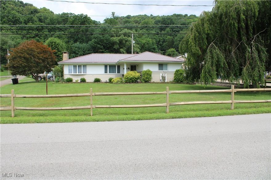 Clarington OH well maintained Ranch home on basement.  2 or 3 bedrooms with 1.5 baths.  Custom-built cabinets in the kitchen, which is open to the dining area.  Living room and a family room..  Hardwood floors exposed in bedrooms.  New roof on home and garage just last year.  

Detached 2 car garage with overhead storage area.  Nice size front lawn on corner lot.  Town water and sewer.  View of Ohio River from the front yard.  Home is NOT in the flood zone.