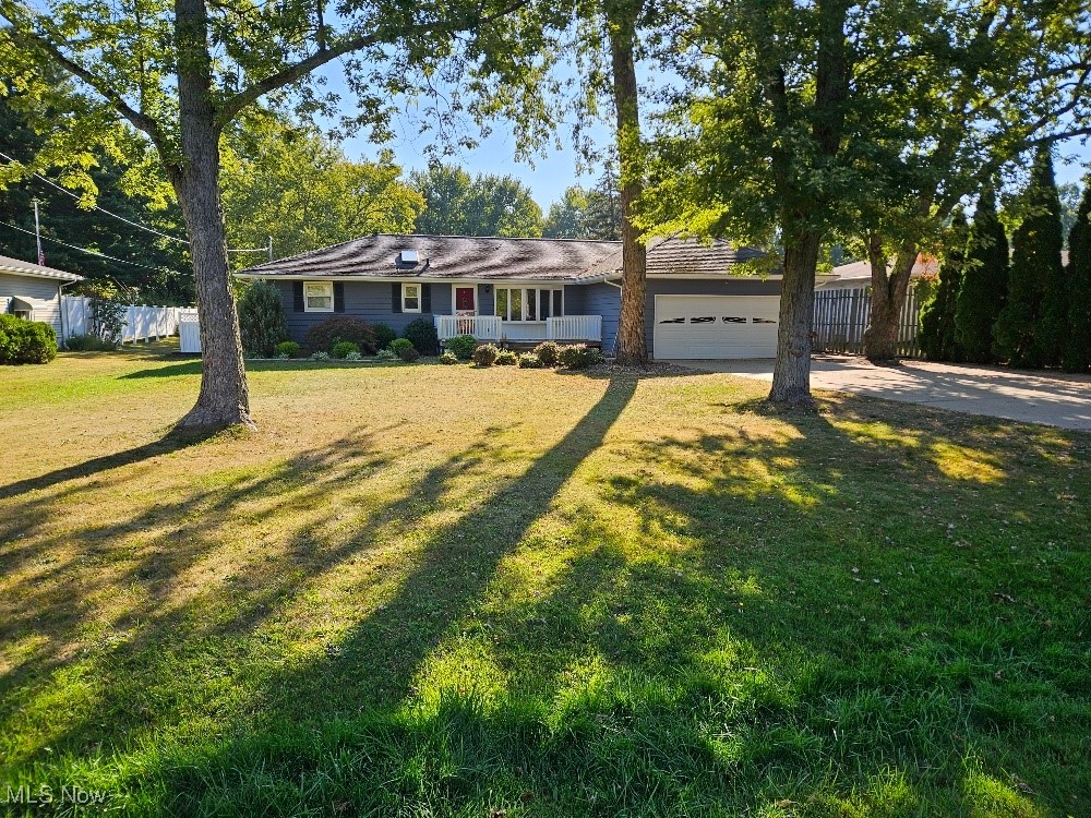 Spacious ranch home in Green School District on a dead-end street. Main floor features an applianced oak kitchen, a living room, a large family room, three bedrooms with hardwood floors, and 1.5 bathrooms. Attached 2-car garage with a concrete driveway. Front and rear decks, a spacious rear patio, and a fenced backyard with a garden shed. The basement has an updated gas furnace and A/C. Well and septic. Terrific location! Check it out!