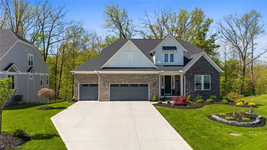 Experience modern luxury in this beautifully crafted 2024 built home, ideally situated on a beautifully landscaped premium wooded lot on a cul-de-sac in the coveted Lakes of Orange community. Designed without compromise, the home showcases upgraded materials and finishes throughout, including additional cabinetry, floor to ceiling stone fireplace, wrought-iron spindle staircase, direct-vent range hood, dual-zone HVAC, tankless water heater, enhanced flooring, high-end appliances, Hunter Douglas window treatments, Custom Closets, storage cubbie lockers, EV charger, irrigation system, landscape lighting and Leaf-guard gutter system. Offering over 3,600 square feet, the Bourges home design welcomes you with a dramatic two-story foyer and a private first-floor office just off the entry. The heart of the home unfolds into a stunning two-story gathering room with a floor-to-ceiling fireplace, seamlessly open to a gourmet kitchen featuring a large quartz center island. Just beyond, the spacious sunroom and dining area offers oversized windows showcasing the home’s heavily wooded and private setting while allowing in abundance of natural light. The first-floor owner’s suite provides a private retreat complete with a tray ceiling, spa-like dream bath and generous walk-in closet. A well-designed laundry room with ample cabinetry and counter space is conveniently located near the attached three-car garage, along with a functional 'drop zone' with built-in locker cubbies and walk-in pantry. Upstairs, you’ll find three additional bedrooms, each with access to a full bathroom, offering comfort and flexibility. The expansive unfinished walkout basement is filled with natural light and plumbed for a future full bathroom and beverage center/bar. Over 2,000 sq ft of space offers incredible flexibility for a future owner to create whatever best fits their lifestyle whether that’s a home gym, theater, guest suite, game room or additional bedrooms. Schedule your private viewing today!!