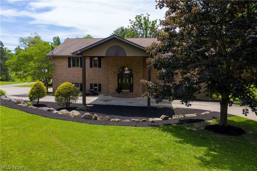 You must see to fully appreciate this beautiful and spacious home with a contemporary flair. After recent upgrading, your new home is move in ready! The open floor plan invites for easy gatherings, while the flexible & smart layout also provides lots of privacy and can easily adapt to your needs. The 2-story open foyer leads to a beautiful great rm accented by a cathedral ceiling with skylights & a wall of windows providing for an abundance of natural light. The marble double sided gas fireplace, separating the great rm and the dining area, creates the perfect ambiance for all seasons. The stylish built-in granite bar can serve anytime! The lg. welcoming kitchen features custom cabinets, granite counters, desk, & SS appliances. Enter the master suite thru french doors to find dbl closets, spacious en'suite bath w/ dbl vanity & walk-in shower. Enjoy a beverage on  the private deck from your master suite or great room overlooking the backyard. Another bedroom, full bath, powder room, lau