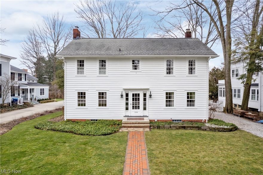 Don't miss this rare opportunity to own a charming home in one of the best locations in the Village district in Hudson (zone 5). Nestled across the street from the Western Reserve Academy and the famous Loomis Observatory, this exquisite property is just a stone’s throw away from Downtown and First & Main!

Gleaming hardwood floors guide you through the home, highlighting exceptional millwork and vintage windows that add character and warmth to every room.

The grand entry opens to a spacious living room with crown molding and a mantled fireplace. There is an elegant formal dining room and a bright office with custom built-ins. The bright kitchen presents stainless steel appliances, a stainless steel prep area and a sunny eating area with outdoor access. The enclosed sunroom offers beautiful views of the outdoors and idyllic backyard with old growth trees and a quaint patio.

Upstairs is the owner’s suite featuring a sitting area and large walk-in closet with en-suite bathroom. Two additional, generous-sized bedrooms and a full bathroom complete the second floor. Beyond the second level is an unfinished third floor that can be used as storage or potentially finished for additional space.

The newly built outbuilding features a gorgeous 1,050 sq ft apartment upstairs with a living room, two bedrooms, a full bathroom, and kitchen area – adorned with gleaming hardwood floors and stunning wood-beams. This outbuilding is IDEAL for hosting out of town guests, working from home, or a teen/in-law suite! There is also a heated, oversized 2 car garage.

Built in 1928 with expert craftsmanship that flows through the whole home, you'll enjoy the quality structure, a modern outbuilding and an incredible location for walking to restaurants, shops, and all of Hudson’s desirable cultural activities!