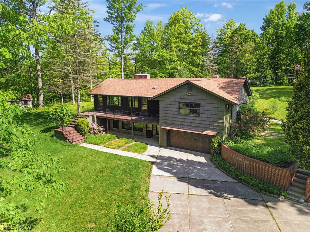Nestled on a sprawling 5-acre parcel in Strongsville, Ohio, this unique mid-century home radiates retro charm and offers endless potential for renovation, remodeling, or a complete rebuild. With panoramic views of the surrounding natural beauty, this property provides a serene retreat for those seeking tranquility amidst the bustling city. For the visionary homeowner or developer, the expansive acreage presents an enticing opportunity for subdivision or to reimagine the existing structure into a contemporary masterpiece. Conveniently located near highway access and only 20 minutes from Downtown Cleveland, 15 minutes to Hopkins Airport, close to shopping centers, and dining establishments, residents will enjoy easy accessibility to urban amenities while relishing the privacy offered by the property's expansive grounds. Nature enthusiasts will delight in the property's proximity to the Metroparks, offering endless opportunities for outdoor recreation. Whether you're dreaming of a secluded retreat, a family compound, or a luxury development project, this rare offering promises a canvas for unlimited possibilities. Don't miss your chance to make your mark on one of Northeast Ohio's most sought-after communities – seize this opportunity to create your own vision.