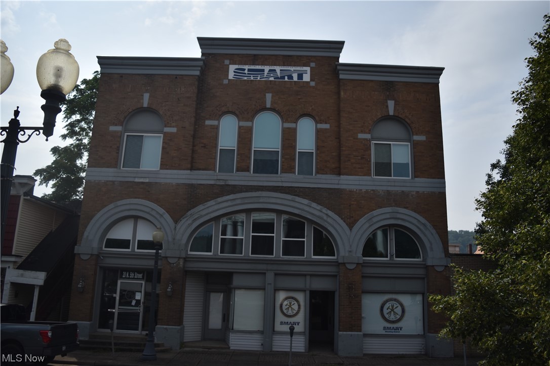 Outstanding Commercial building located in the center of Martins Ferry on a highly traveled street. This property has the opportunity to be whatever your mind can create. There is a wonderful massive meeting room with a stage, so it could make a great dance studio. It also has elevator chairs on each floor. Many updates include some replacement windows all in front and some in other parts of the building in Nov of 2018, a rubber roof installed summer of 2015, A/C 2016, parking lot July 2013, remodeled middle floor and added bathroom Jan. 2019, 3 HVAC units in middle floor April of 2019, front mortar 2015. Spacious parking lot located across the street from the building.