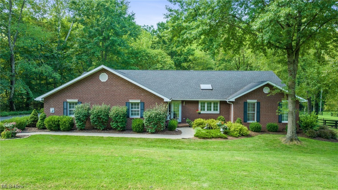 Beautiful Brick ranch 6.5 acre Horse farm. 2 BR with large great room - kitchen open concept. The morning room off the Master suite leads to a very nice screened-in porch. The Two sets of French doors off the spacious great room lead to all-new decking to enjoy relaxing views of the backyard and Mill Run Creek.. Black aluminum and wood fencing surrounds the entire property with a privacy gate at the beginning of the driveway. Large Indoor Riding arena, fixed outdoor riding pen, two-stall barn, and a separate building for farm equipment with two fenced-in pastures off the barn make this a great horse property.