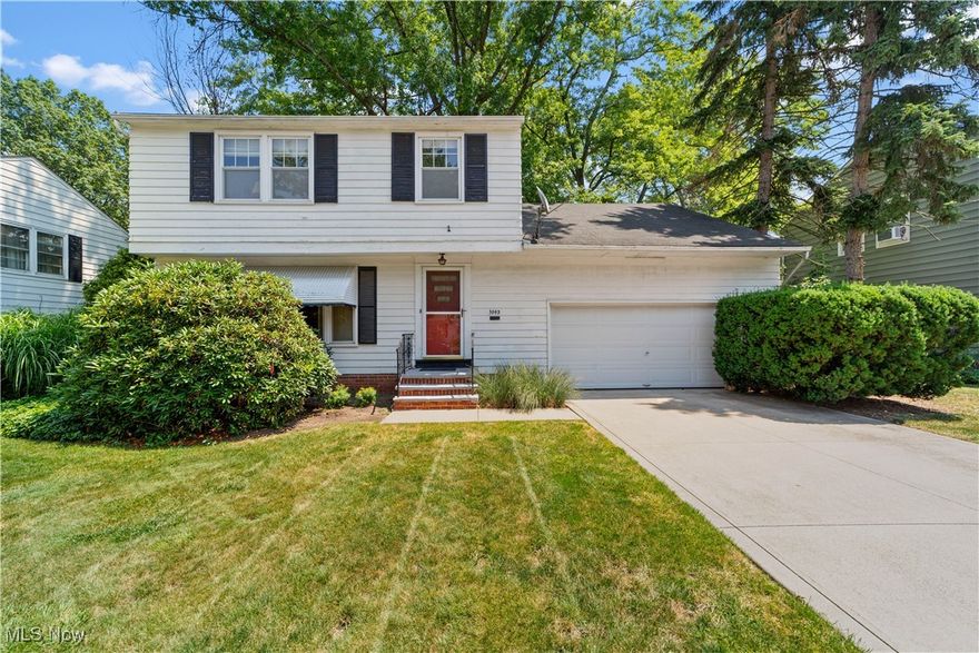 Welcome to this lovingly maintained two-owner home on one of South Euclid’s most beautiful and quiet streets. A true time capsule, this home has remained untouched by modern trends but has been impeccably cared for over the years, offering a rare opportunity to own a piece of preserved charm. Inside, you'll find original hardwood floors hiding beneath the carpet, ready to be revealed and restored. The first floor offers generous living space, including a spacious living room and a formal dining room perfect for gatherings. The kitchen boasts original wood cabinetry and a delightful breakfast nook full of character. Off the back, a cozy sunroom provides additional living space during the warmer months and makes the perfect spot to enjoy morning coffee overlooking the serene fully fenced backyard. Upstairs, a large bedroom currently used as a family room offers flexibility to suit your needs. Three additional bedrooms and a full bath complete the second floor, including a well-appointed primary bedroom with beautiful hardwood floors and abundant natural light. The full, unfinished basement provides excellent potential for a rec room or workspace, with laundry conveniently located on the lower level. A large attached two-car garage adds extra functionality and ease. Cherished by the same family for over 45 years, this home is a true gem just waiting for its next chapter. Located in a vibrant, welcoming community—don’t miss your chance to make it yours!