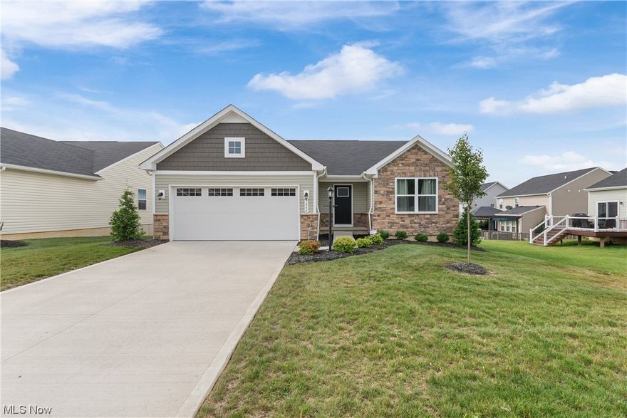 No need to build when you can move right in to this newer ranch with open concept living that's only been occupied a few months each year. Sellers added almost $40K with numerous builder upgrades including hard surface LVT flooring in LR, highest upgrade group with Quartz counters, tile throughout baths, tile master shower and double sinks, 36" handicapped accessible doors, deck, lot premium, ceiling fans w/remotes in LR and Master Br, gas hookups, Guardian security system, added window coverings, and much more! Home has split floor plan with Main bedroom, bath, and laundry separate from 2 other bedrooms and guest bath. Double the size of the home by finishing the basement. Great Perry neighborhood with convenient location minutes to Rt 30, Rt 21, and Massillon or Canton. Won't last!