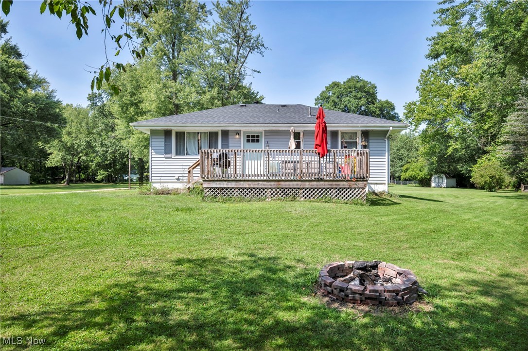 This adorable Leavittsburg home offers picturesque riverside views, plenty of renovations, and is close to many amenities! Relax and take in the tranquil surroundings of this unique waterfront property! The three-bedroom layout features a spacious living room with beautiful hardwood-style flooring and newer large windows that offer a ton of natural light. The kitchen is stylishly updated with butcher block countertops, modern stainless appliances, and plenty of cabinetry. The elegant full bath showcases ornate tiled shower and hex tiled flooring, complemented by a simple yet sophisticated vanity. Each bedroom has hardwood style flooring and includes ample closet space. The basement provides a newer hot water tank, sump pump, utility space, crawlspace storage, and an additional bonus room. The new roofs on the home and on the detached 1.5 car garage that hosts electric and heat, complete the exterior of this lovely home. Call to schedule your showing today!