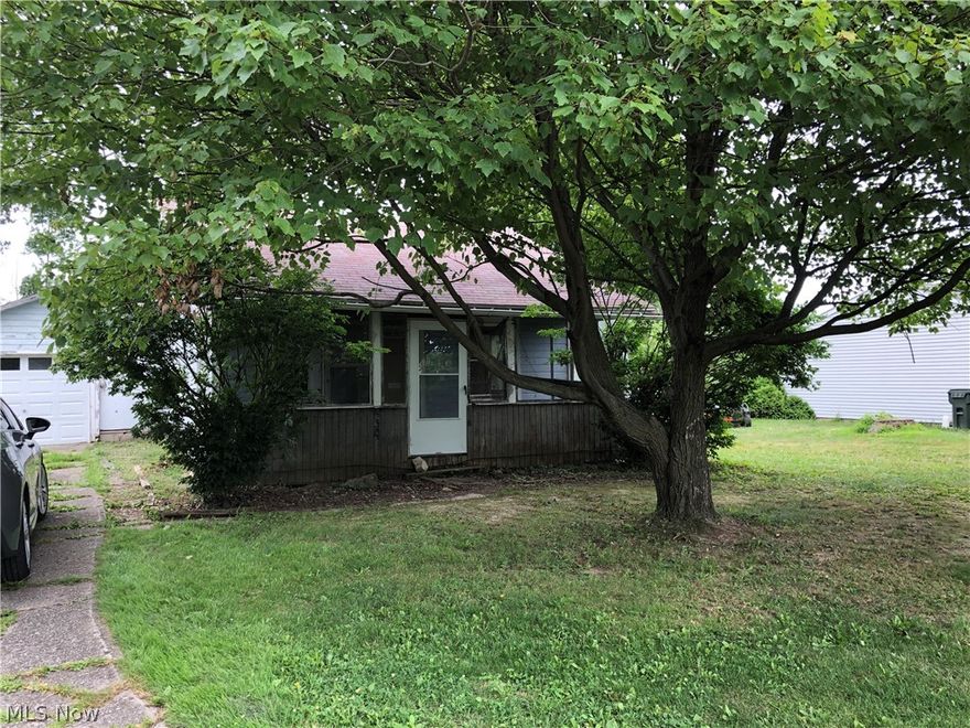 Opportunity abounds in this quaint cottage.  2 bedrooms, a spacious living and dining room as well as an entire back addition.  The home is situated on 2 lots- for a total of 80 ft of frontage and offers a enclosed front porch for enjoying those summer lake breezes, a large shed and an attached 1 car garage.