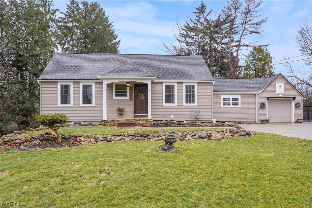 Keeping the charm and character, this home received a total custom, high-end redesign in 2017 and is one of a kind. The detail is amazing throughout including bold, beautiful stained woodwork with wide baseboards and trim on every doorway throughout the home. Enter into the spacious living room and notice the large windows, which allow for an abundance of natural light. The eat in kitchen offers maple soft close cabinets, plenty of counter space and includes the SS appliances. The owners suite features a
7' x 6' walk in closet and nice full bathroom with tiled walk in shower including a bench seat & rain head/hand wand. Another bedroom and arched doorway office complete the first floor. As you walk down the quarter turn staircase to the lower level, find a bedroom with large windows, full bath, rec room with a convenient exterior entrance leading to the patio. The concrete driveway has a parking/turn around that is 3 cars wide and even the Goalrilla in-ground basketball hoop conveys. During Spring, Summer and Fall step out the back door and sit on your large, curved, concrete patio incorporated with a firepit and enjoy the serene, countrylike setting. Grill out on your natural gas Weber grill, and In the summer, the outdoor shower on the patio will be a nice convenience. The attached heated garage is extra deep. Minutes away from Rt. 8, the Cuyahoga Valley Towpath Trail, Hudson's specialty shops, restaurants and grocery stores is an ideal location. Every inch of this home was updated in 2017 including the roof, Pella windows, new well head and pump, furnace, and AC. Hot water tank -2023. Waterproofing was completed in 2019 by Pioneer Basement Solutions with a lifetime warranty. This home is truly amazing.