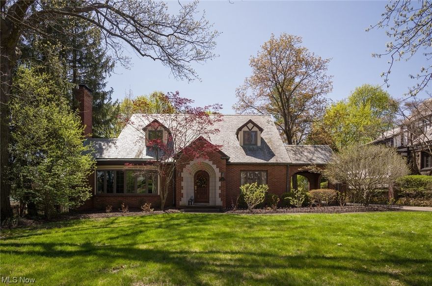 You'll find perfection in this French County Tudor in the heart of historic Ridgewood! Fully updated throughout while maintaining the character of an historic home; this rare find in Ridgewood has 3 large bedrooms, 2.5 baths with a first floor bedroom/bathroom, first floor laundry room & large walk-in closets. Formal spaces include a gracious living room with expansive bow window & fireplace and an elegant formal dining room with access to a lovely covered side patio.  The eat-in kitchen has quality cherry cabinets, quartz countertops, stainless appliances & plenty of storage. Beautiful cherry built-ins grace the family room. Upstairs are 2 large bedrooms with walk-in closets & a recently updated full bath. The basement provides Naturestone flooring, a fabulous recreation room with WB fireplace & a wine room. Enjoy beautiful evenings on the flagstone patio surrounded by mature landscaping. This is such a wonderful home!