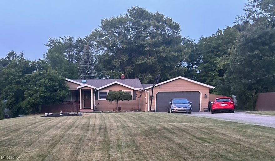 Be Ready to be AMAZED. This Ranch Style Home looks modest on the exterior, but offers the :WOW!" factor as soon as you enter. The  Open Floor plan and cathedral ceiling makes this home feel huge . Updates throughout , Modern design, and an AMAZING yard in The Heart of Strongsville, OH. The spacious Front Room flows beautifully into the Kitchen , then leads you into the Dinning area. The Master Bedroom was converted from the original garage space into an awesome Master Suite, then an attached Garage was constructed to maintain the 2 car garage space offered in the original floor plan. There are 2 additional bedrooms on the first floor and a third room (Office/Flex Space) ....  As you pass through the Kitchen you'll find your way to the massive finished lower level/basement. Here you will find Bedroom space, Lounge/Gaming Room, Kitchen, Full Bath, and Utility Room. This Area is HUGE!. Both Front Yard and Back Yard have a Park-Like Feel with A LOT of privacy to RELAX and Entertain Guests.  Don't miss this rare opportunity to secure your Dream Home.  You'll be glad you scheduled a Tour Today!
