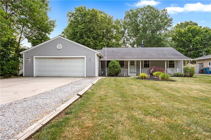Back on the market at no fault of the property or seller. Sprawling ranch in a prime location of North Ridgeville. Situated on two parcels, totaling 1.28 amazing acres! The charming covered front porch greets you as you enter the home. Home boasts an attractive, rustic country style. Very cozy and welcoming. Spacious living room opens to the eat-in kitchen boasting island/breakfast bar with seating and a beautiful bay window overlooking the backyard. Down the hall are 3 bedrooms and the newly remodeled full bathroom w/ new tub & tub surround, new flooring, updated cabinetry and linen closet! Large laundry/mudroom w/ door to backyard - perfectly placed between the kitchen, garage and additional living space. The additional living suite is massive and can be used as a 4th bedroom, rec room or whatever you desire. The attached garage is an impressive 672 sq ft w/ gas heat, upgraded electric/220 line for all your shop needs! Heading on back, your outdoor oasis awaits - perfect for relaxing and/or entertaining - complete with a spacious deck, outbuilding and 24 ft above ground pool w/ newer liner and pump. Many big ticket updates over the years including Roof, Siding, Gutters, Windows, Doors, Driveway (2009) Furnace & Central Air (2020), Hot Water Tank (2010) and so much more.. Do not wait! Call for your private tour TODAY!
