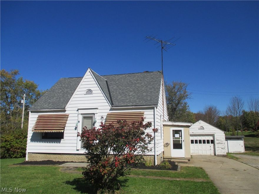 Cute little charming 2 bedroom bungalow ,,,attic is semi finished and could be turned into a 3rd bedroom, playroom or computer room.  Kitchen with eating area is done in knotty pine...located on a corner lot with 1 car detached garage and a shed in back yard.