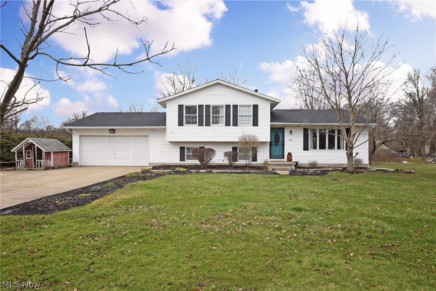 Welcome to 4193 Helmick Avenue in Norton!  You will not find a more spacious, updated, and well priced home in town! This beautiful home offers a newer roof (2016), new hot water tank (2019), updated appliances, paint, flooring, and lighting throughout.  As you enter thru the foyer, to the right is the large formal living area which opens into the dining. Both of these rooms offer a shiplap accent wall, making this home so up-to-date.  Moving into the kitchen, you'll find granite countertops, subway tile, modern industrial shelving, and stainless steel appliances. The first floor of this home has a total open floor plan feel. Moving upstairs, the huge master suite offers double closets and a full bath. The two additional bedrooms offer custom paint, plenty of closet space, and natural light! There is an additional large full bathroom on the second floor with plenty of cabinet space. In the lower level, You will find a gigantic family area with white brick fireplace, rec room opening in