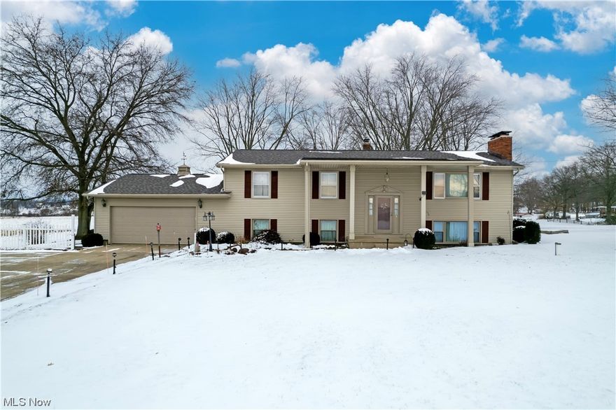 Welcome to Yoder Road!  Don't miss out on this spacious 3-4 bedroom, 3 bath home on one acre in Smithville School District. This one owner home offers 3 bedrooms and 2 full baths on the main level, along with a full kitchen, dining room, and a cozy 3 season room with beautiful country views.  In the lower level which is above grade there is a large family room with a beautiful wood burning fireplace as the focal point, a 2nd kitchen, and full bath.  There are 2 additional rooms ideal for storage, workshop or additional bedroom space, and complete with your own private hot tub room with cedar walls!  The heated 40x30 pole barn is perfect for storage, toys, and additional parking. The home has great bones, complete with a new roof and hot water heater in 2023,  A/C 2022, and exterior siding some windows have been updated in recent years. Don't miss the chance to make this home your own, and enjoy peaceful country living!
