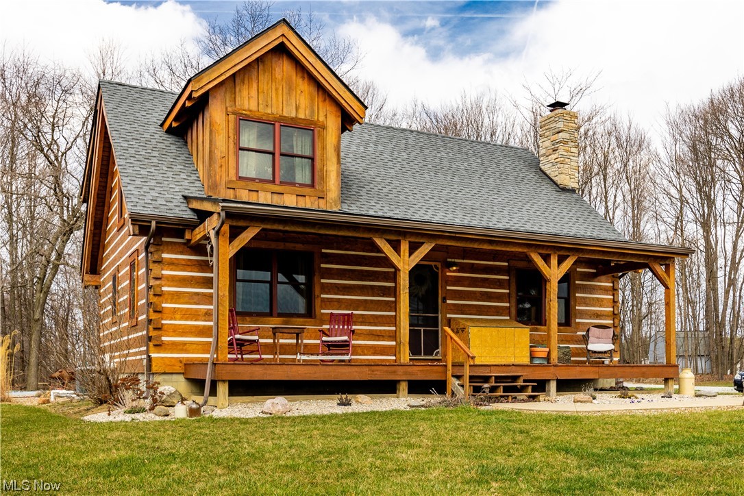 Welcome to this Stunning and unique 3 bedroom, 2 full bath log home that offers a peaceful and serene country lifestyle that is situated on 6.7 acres and sitting back 1000 feet from the road. There is a huge 28x44 heated pole barn with a concrete floor, opposing 12 ft overhead doors and finished interior for family entertainment during all seasons or whatever your hobby may be! The front of the property has mature hardwoods and fruit trees and at the rear of the home is sprawling wood deck and a beautiful 10x25ft inground pool. The remainder of the property is a tranquil wooded ravined area. As you enter the exquisite Old Virginia hand hewn log home you will be taken back by the home's country elegance graced with a floor to ceiling stone fireplace, eat in kitchen and open second floor balcony. There is also a bedroom, full bath, dining area and a large pantry/mudroom on the first floor. The second floor has a sizeable owners suite, Full bath and flex space that could be used as the third bedroom, office, craft room etc. The basement has additional finished living space with a large laundry area. The primary heating and central air source is a forced air gas furnace however both the home and barn have SUPPLEMENTAL heat sources such as a Taylor outdoor wood burning furnace and an indoor pellet burning stove in the lower level. These options offer the flexibility for alternative cost effective heat that can be fueled by wood sourced from your own forest which promotes sustainability from within your own property! This home provides the elegant beauty of nature with the convenience of a modern stylish log home! This is a must see property. Call to schedule your private tour!