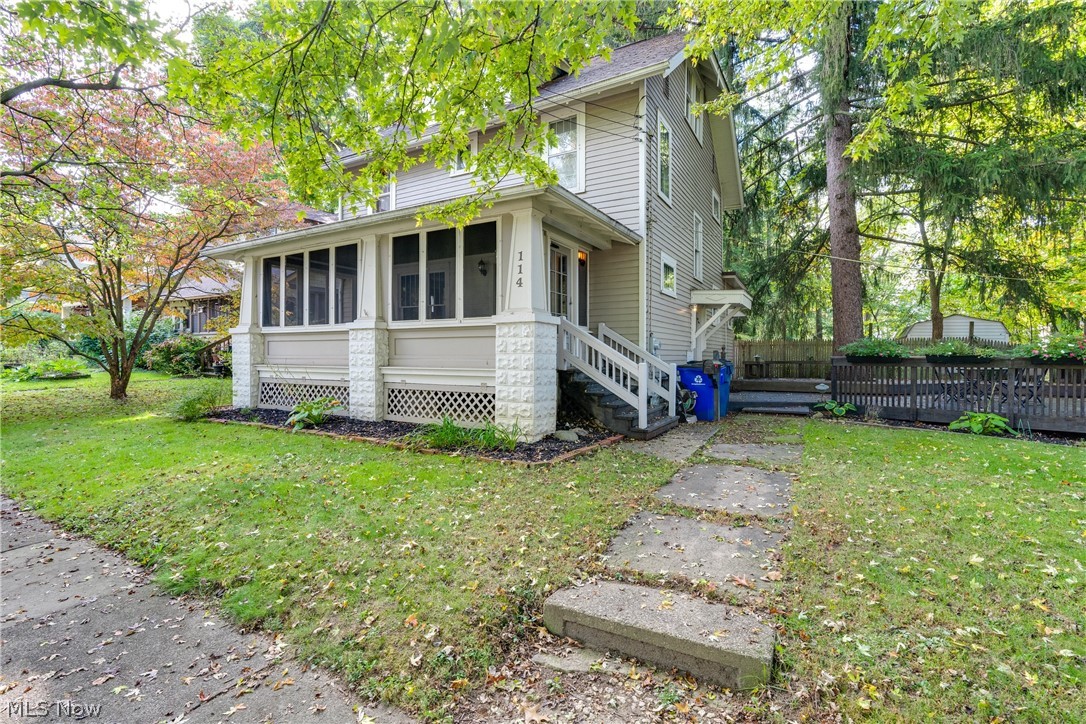 Beautiful Kent home, minutes from historic downtown and KSU! Close to all local restaurants and attractions! Beautifully decorated! Preserved natural woodwork! Wonderful enclosed front porch for outdoor living! Large living room open to the formal dining room. Light and bright with a lot of windows from front to back! Adorable, updated and fully applianced kitchen! Large built in pantry! Plenty of room and counterspace! The second floor features three good size bedrooms, updated bathroom, large linen closet and an awesome built in cabinet. The storage in this home will not disappoint! The 3rd floor is so spacious! Currently used as a playroom and can easily be a 4th bedroom. Laundry room is in basement, plenty of space for all your storage needs! Washer and Dryer stay. Outside you have a 1 car garage and this fabulous deck with built in seating, tons of room to entertain or simply relax and enjoy! Recent updates include furnace and a/c (2020), New dryer (2020), Newly painted throughout